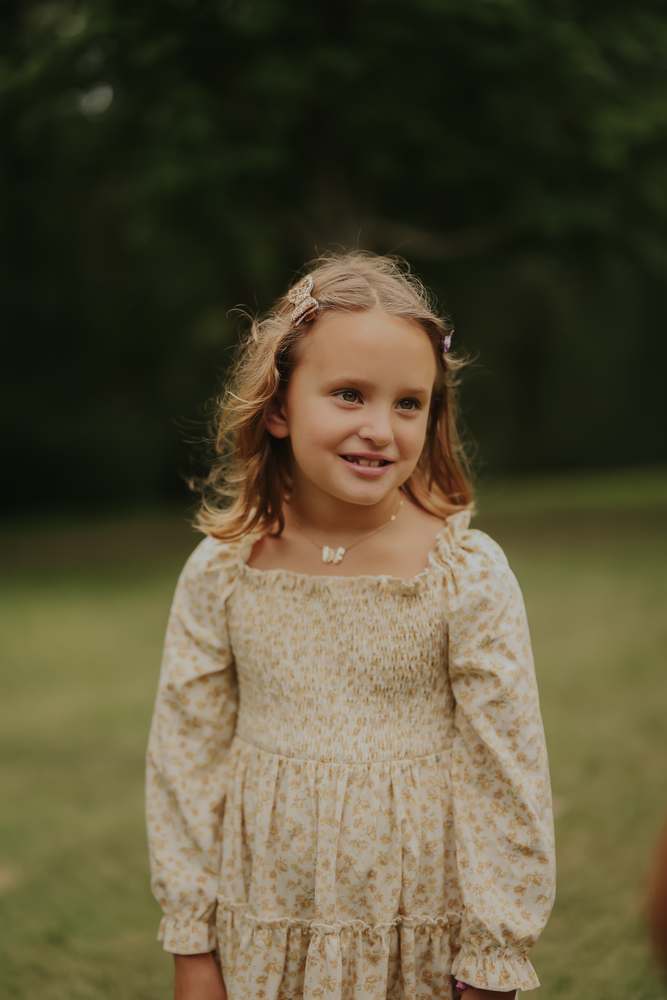 Portrait of a girl in the tall grass