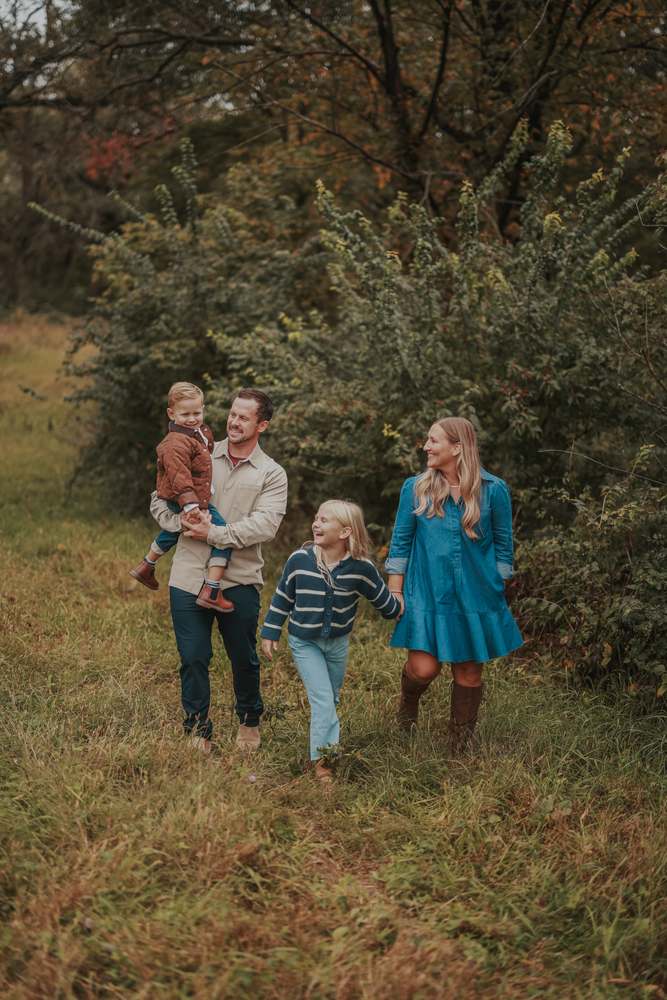 A family walking the trail together, the kids laughing