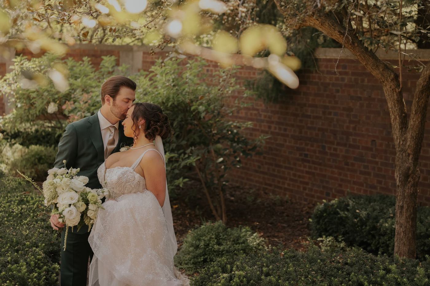 A bride and groom together in the garden after the ceremony