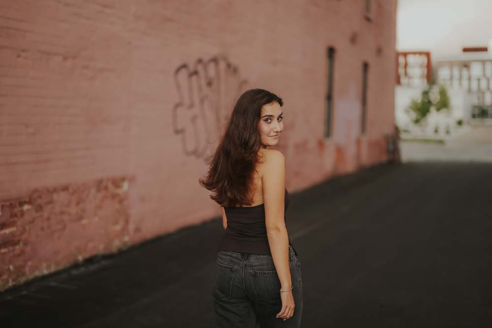 Looking back over her shoulder