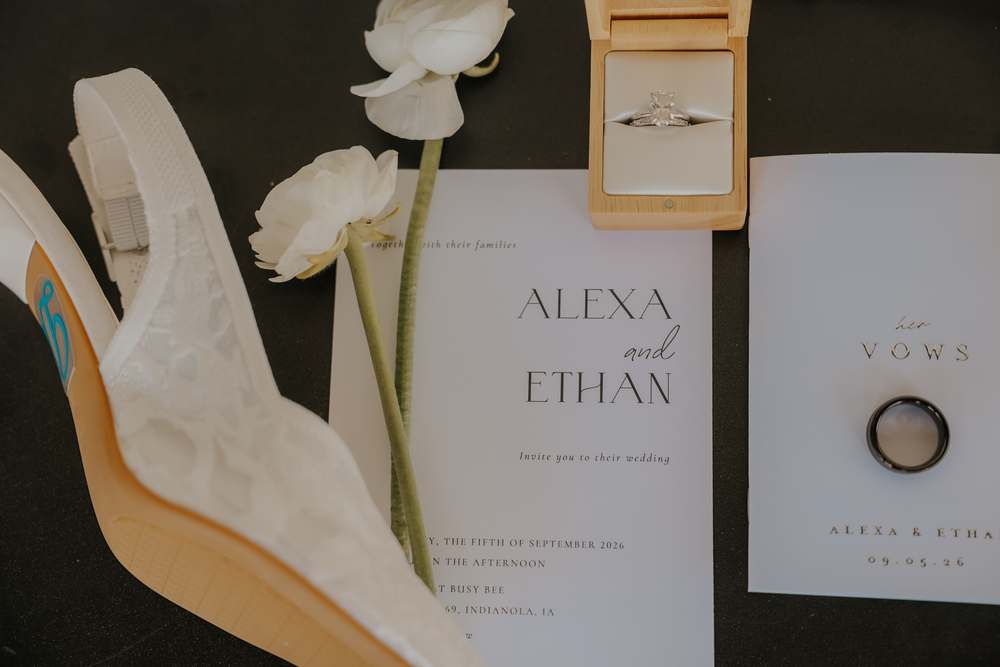 Invitation suite laid out with the rings