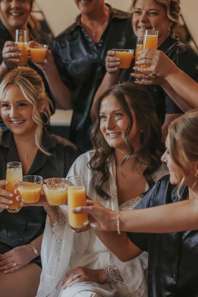 A toast with the bridesmaids in the getting-ready suite