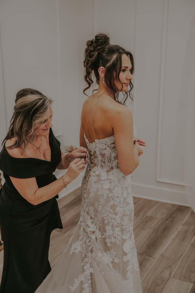 Lacing the back of the gown