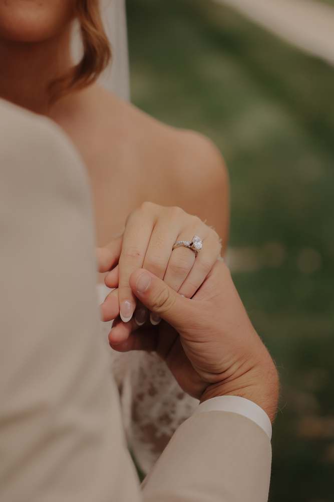 The wedding band on her hand