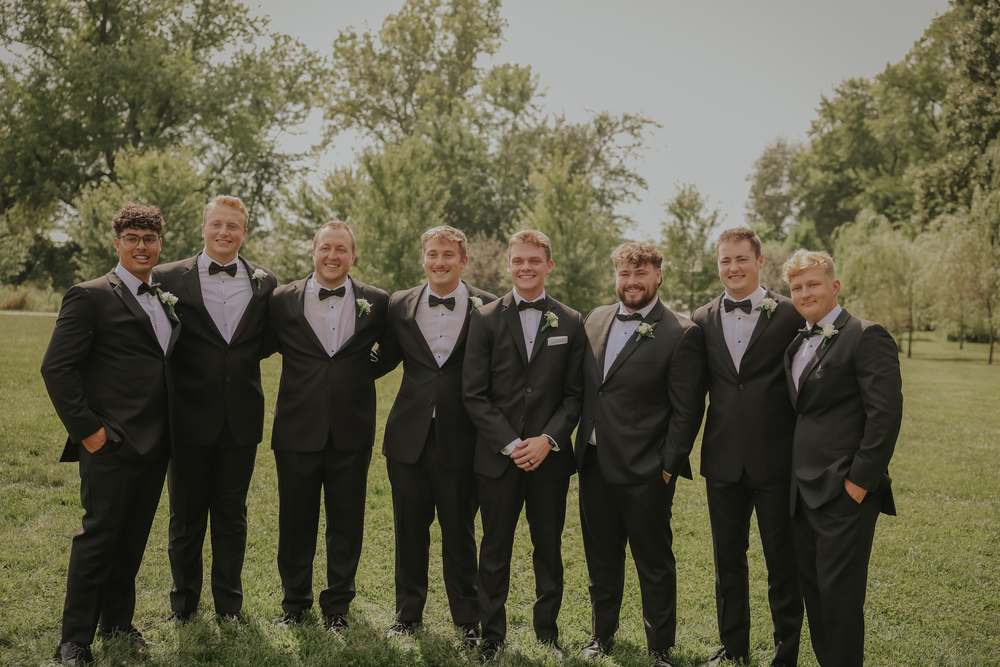 The groomsmen in the field