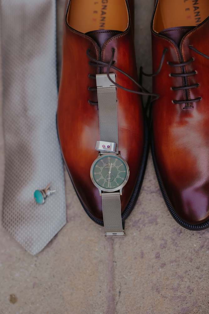 The groom's shoes, tie and watch
