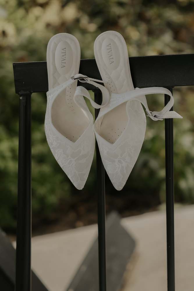 Bridal heels resting on a garden chair