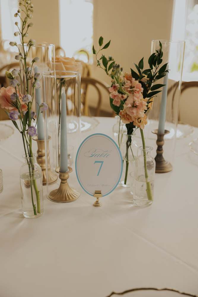 Table number among the bud vases